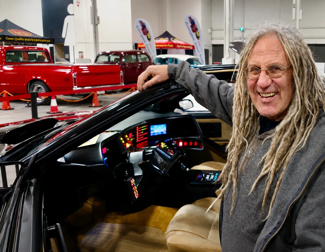 Mike Hall from Rust Valley Restaurations sitting inside the cockpit of the AGI KITT replica car at the Motorama Custom Car Show in Toronto