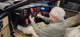 William Daniels signing the steering wheel of KITT